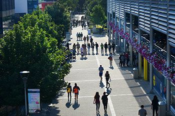 Campus view from above with students walking below