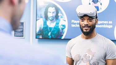 Male student wearing virtial reality headset