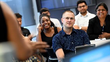 Student studying in a classroom lecture